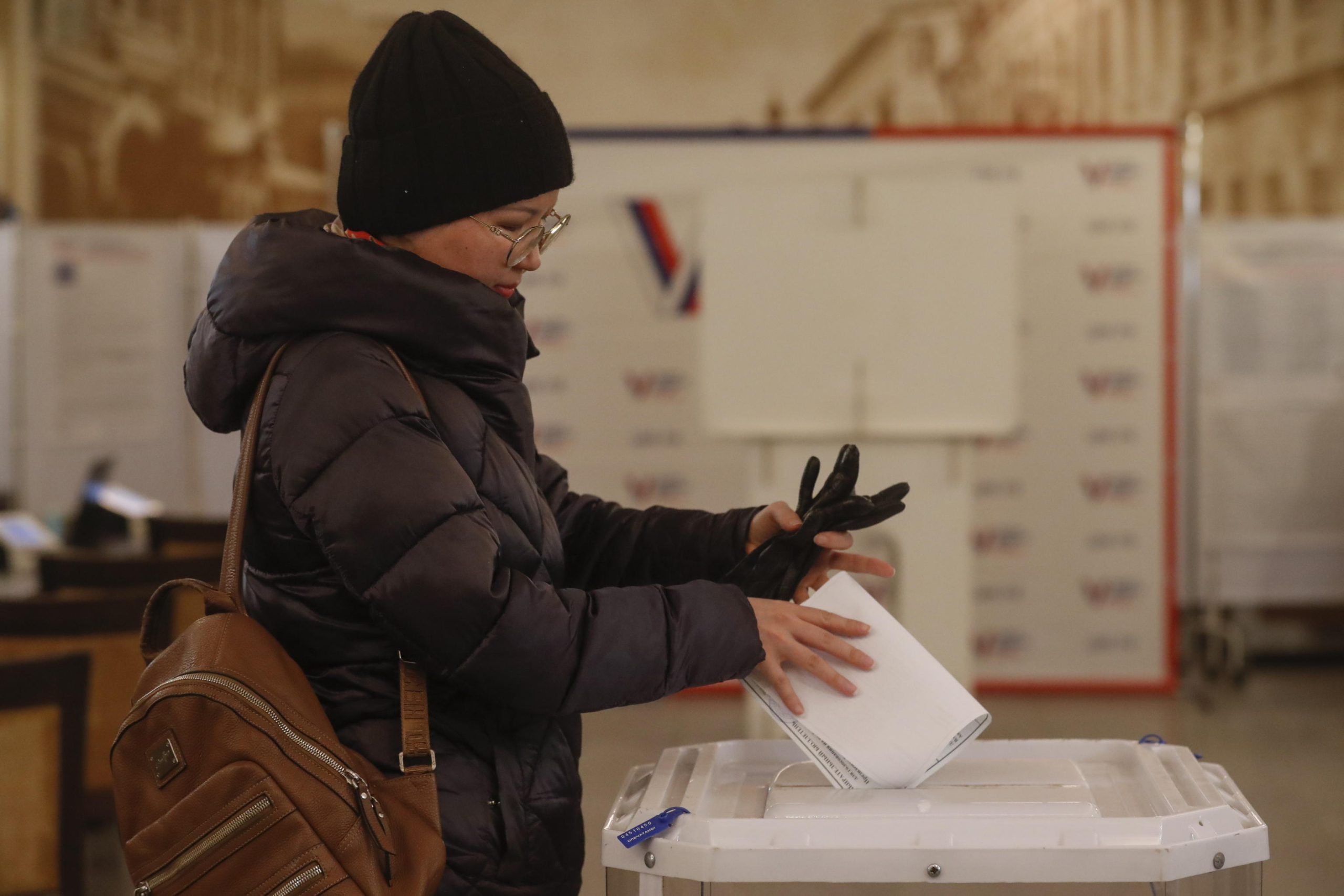 epa11221701 A Russian woman casts her ballot during presidential elections in Moscow, Russia, 15 March 2024. The Federation Council has scheduled presidential elections for 17 March 2024. Voting will last three days, from 15 to 17 March. Four candidates registered by the Central Election Commission of the Russian Federation are vying for the post of head of state: Leonid Slutsky, Nikolai Kharitonov, Vladislav Davankov, and Vladimir Putin.  EPA/MAXIM SHIPENKOV