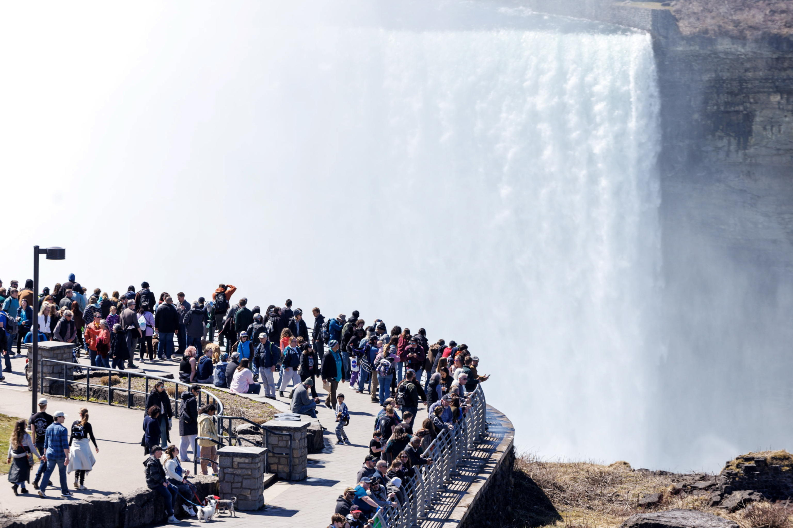 epa11264789 People view Niagara Falls from Terrapin Point in Niagara Falls, New York, USA, 07 April 2024. A total solar eclipse will be visible on 08 April 2024 across North America. Thousands are expected to view the eclipse from the iconic Niagara Falls area.  EPA/SARAH YENESEL