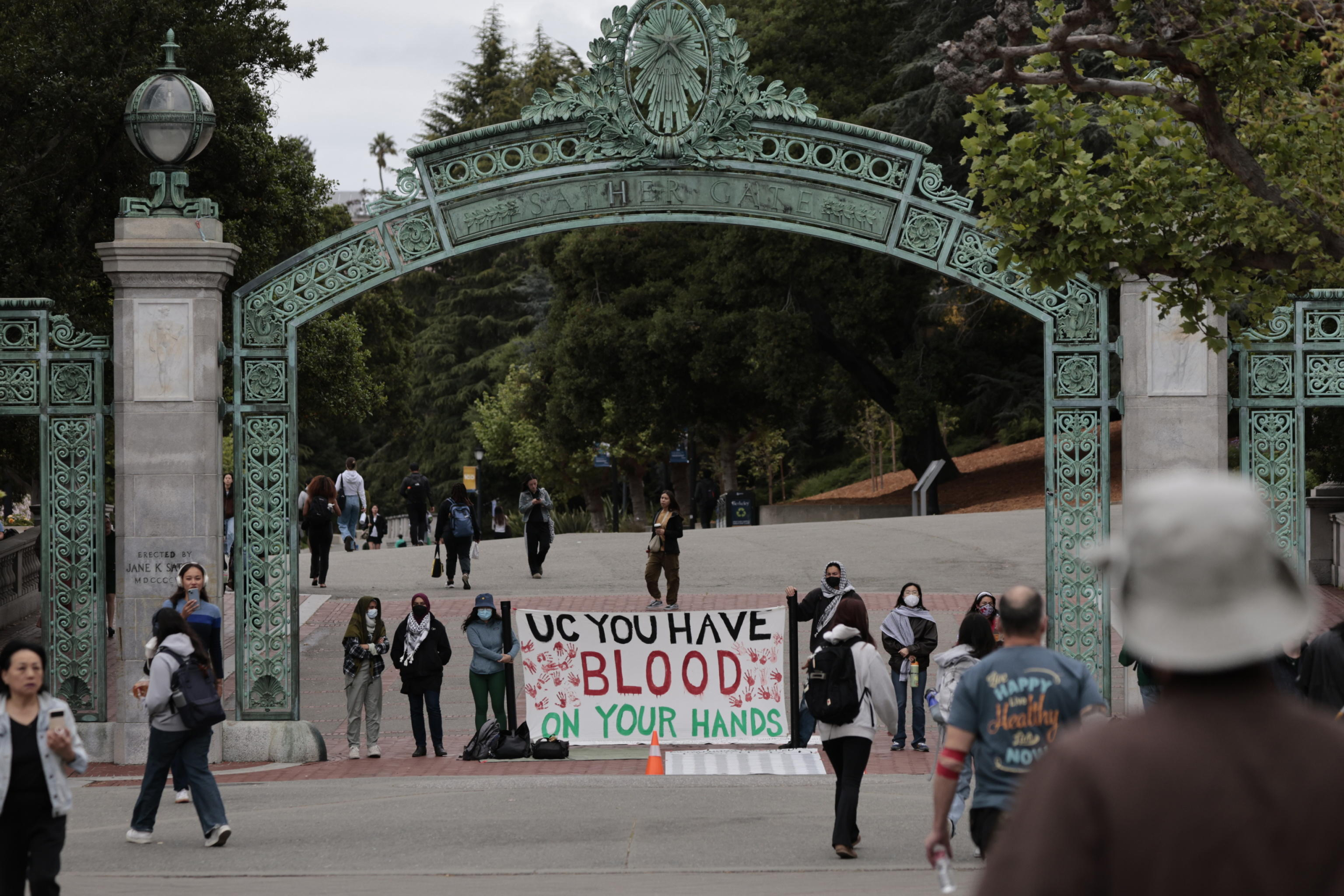 epa11296678 Students stand under Sather Gate at the University of California Berkeley (UC Berkeley) campus to protest UC Berkeleys investment ties to Israel in Berkeley, California, USA, 23 April 2024. More than 34,000 Palestinians and over 1,450 Israelis have been killed, according to the Palestinian Health Ministry and the Israel Defense Forces (IDF), since Hamas militants launched an attack against Israel from the Gaza Strip on 07 October 2023, and the Israeli operations in Gaza and the West Bank which followed it.  EPA/JOHN G. MABANGLO