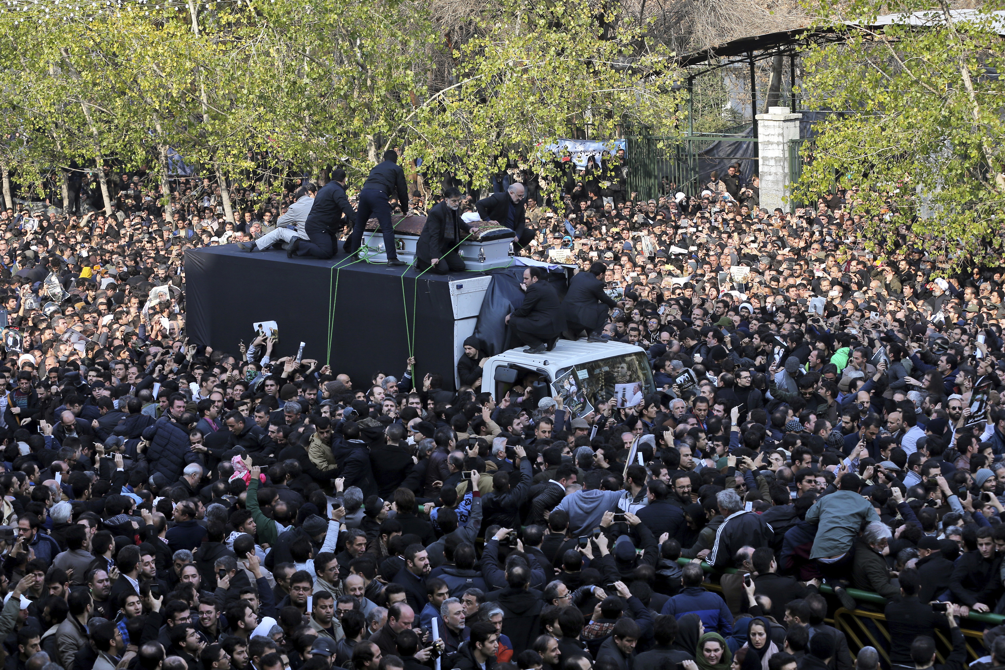 The coffin of former Iranian President Akbar Hashemi Rafsanjani, is carried on a truck surrounded by mourners during his funeral in Tehran, Iran, Tuesday, Jan. 10, 2017. Hundreds of thousands of mourners have flooded the streets of Tehran, beating their chests and wailing in grief for Rafsanjani, who died over the weekend at the age of 82. The crowds have filled main thoroughfares of the capital as top government and clerical officials held a funeral service at Tehran University. (AP Photo/Ebrahim Noroozi)