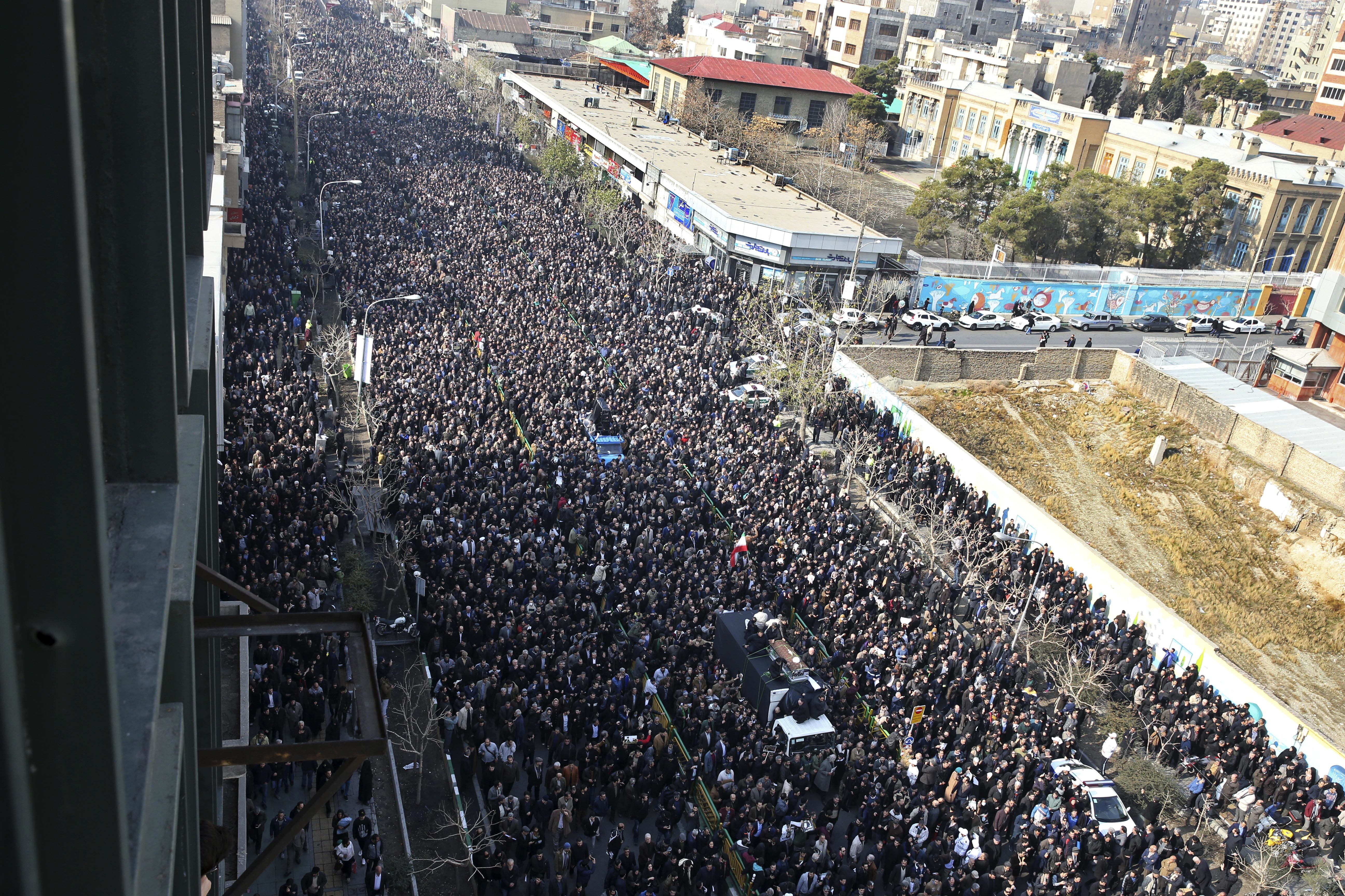 Iranians attend the funeral of former Iranian President Akbar Hashemi Rafsanjani, as his coffin is carried on a truck, in Tehran, Iran, Tuesday, Jan. 10, 2017. Hundreds of thousands of mourners have flooded the streets of Tehran, beating their chests and wailing in grief for Rafsanjani, who died over the weekend at the age of 82. The crowds have filled main thoroughfares of the capital as top government and clerical officials held a funeral service at Tehran University. (AP Photo/Vahid Salemi)