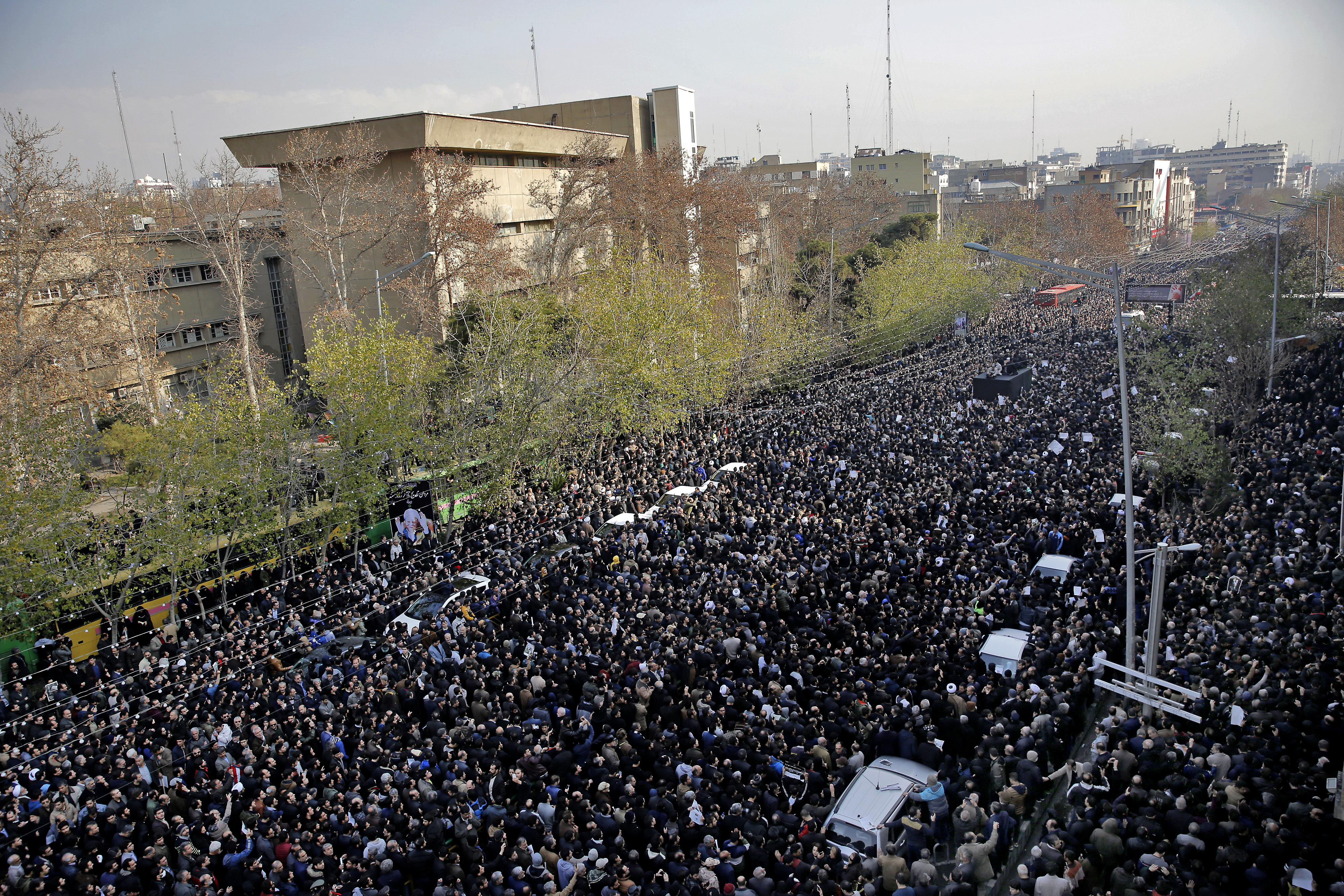 Iranians attend the funeral of former Iranian President Akbar Hashemi Rafsanjani, as his coffin is carried on a truck, in Tehran, Iran, Tuesday, Jan. 10, 2017. Hundreds of thousands of mourners have flooded the streets of Tehran, beating their chests and wailing in grief for Rafsanjani, who died over the weekend at the age of 82. The crowds have filled main thoroughfares of the capital as top government and clerical officials held a funeral service at Tehran University. (AP Photo/Ebrahim Noroozi)