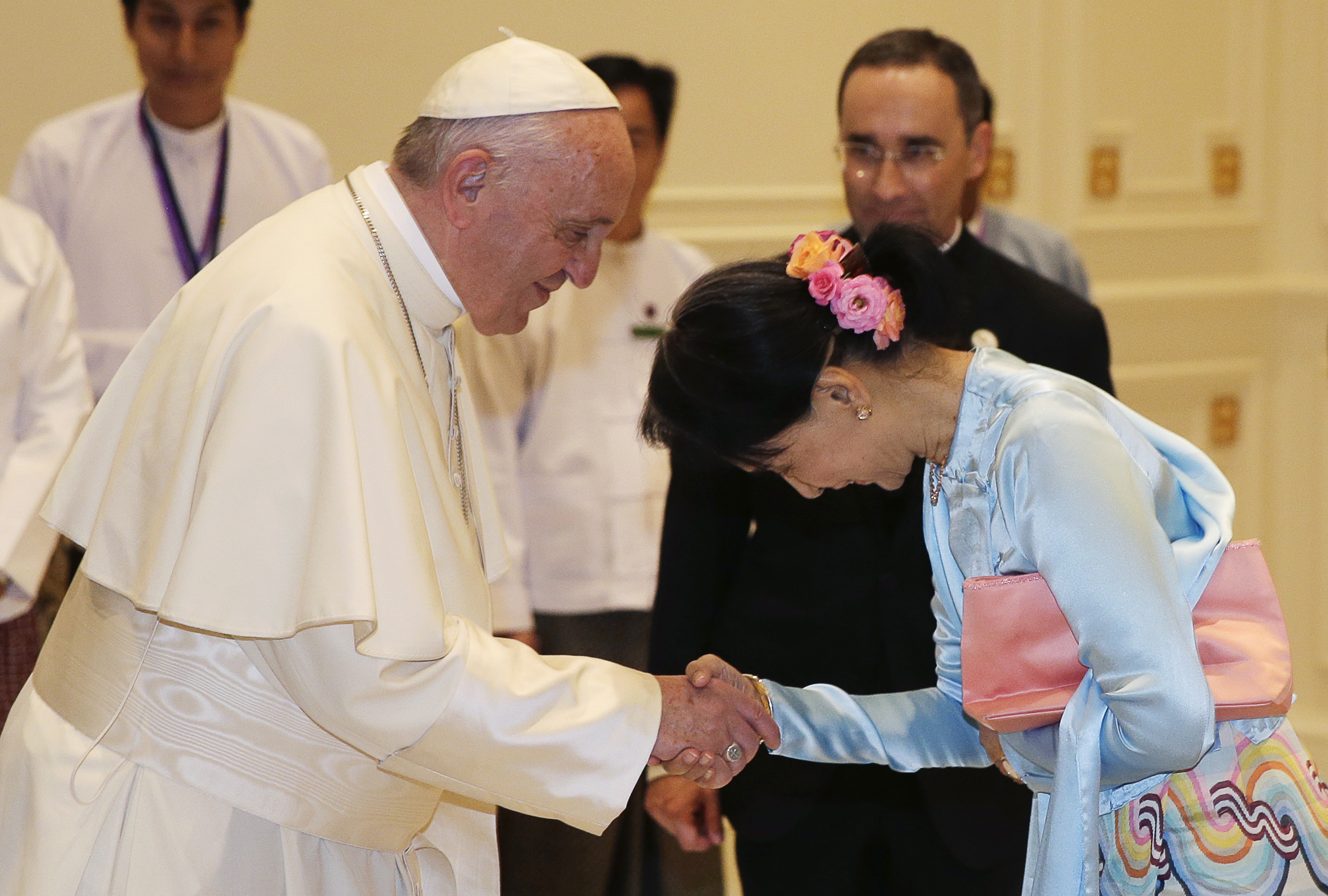 Pope Francis shakes hands with Myanmar's leader Aung San Suu Kyi in Naypyitaw, Myanmar, Tuesday, Nov. 28, 2017. (Max Rossi/Pool Photo via AP)