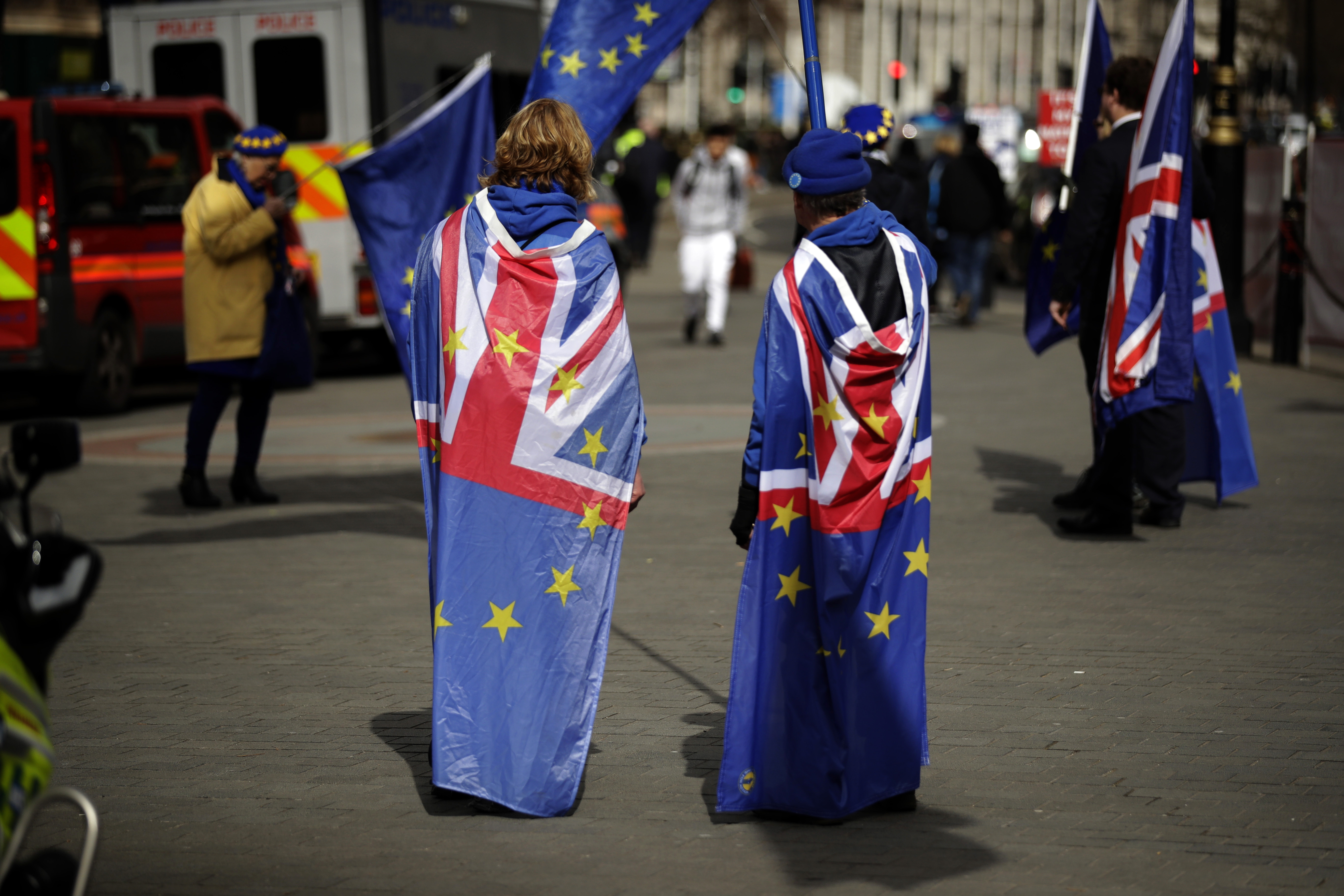 Anti-Brexit supporters protest opposite the Houses of Parliament in London, Monday, March 18, 2019. British Prime Minister Theresa May was making a last-minute push Monday to win support for her European Union divorce deal, warning opponents that failure to approve it would mean a long — and possibly indefinite — delay to Brexit. Parliament has rejected the agreement twice, but May aims to try a third time this week if she can persuade enough lawmakers to change their minds. (AP Photo/Matt Dunham)