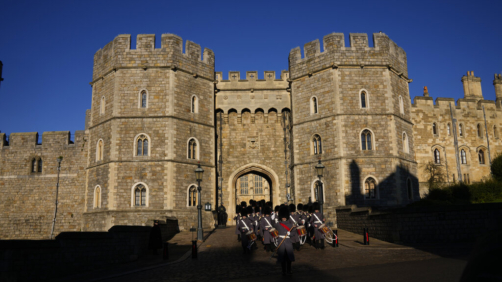 Members of the British Military's 1st Battalion Grenadier Guards Corps of Drums take part in the changing of the guard ceremony outside Windsor Castle in Windsor, England, where Prince Andrew residence is nearby in the grounds of Windsor Great Park, Thursday, Jan. 13, 2022. A judge has — for now — refused to dismiss a lawsuit against Britain's Prince Andrew by an American woman who says he sexually abused her when she was 17. Stressing Wednesday that he wasn't ruling on the truth of the allegations, U.S. District Judge Lewis A. Kaplan rejected an argument by Andrew's lawyers that Virginia Giuffre's lawsuit should be thrown out at an early stage because of an old legal settlement she had with Jeffrey Epstein, the financier she claims set up sexual encounters with the prince. (AP Photo/Matt Dunham)