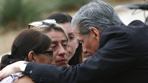 CORRECTS SPELLING TO GARCIA-SILLER, INSTEAD OF GARCIA SELLER - The archbishop of San Antonio, Gustavo Garcia-Siller, comforts families outside the Civic Center following a deadly school shooting at Robb Elementary School in Uvalde, Texas, Tuesday, May 24, 2022. (AP Photo/Dario Lopez-Mills)