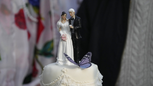 Figurines are displayed on a wedding cake before it was cut by Stella Moris after marrying her partner the WikiLeaks founder Julian Assange in a small wedding service held inside the high-security Belmarsh Prison, in south east London, Wednesday, March 23, 2022. Assange, who is in a legal battle over a decision to extradite him to the U.S. to face spying charges, has been held at Belmarsh Prison since 2019, when he was arrested for skipping bail during a separate legal battle. Before that, he spent seven years inside the Ecuadorian Embassy in London to avoid extradition to Sweden to face allegations of rape and sexual assault. (AP Photo/Matt Dunham)
