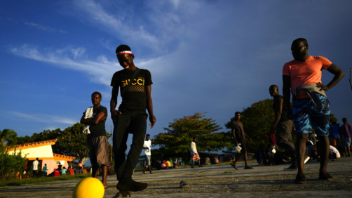 Haitian migrants play a pick up game of soccer at a tourist campground in Sierra Morena, in the Villa Clara province of Cuba, Wednesday, May 25, 2022. A vessel carrying more than 800 Haitians trying to reach the United States wound up instead on the coast of central Cuba, government news media said Wednesday. (AP Photo Ramon Espinosa)