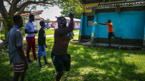 A Haitian celebrates his goal during a game at a campground being used to house a large group of Haitian migrants in Sierra Morena in Cuba's Villa Clara province, Thursday, May 26, 2022. A vessel carrying more than 800 Haitians trying to reach the United States wound up instead on the coast of central Cuba, in what appeared to be the largest group seen yet in a swelling exodus from crisis-stricken Haiti. (AP Photo Ramon Espinosa)