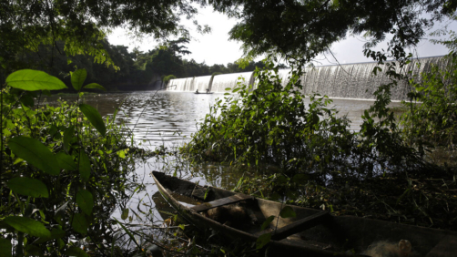A fishing canoe sits near a dam that sources the sacred Osun River in Esa-Odo, Nigeria, on Saturday, May 28, 2022. The river, which flows through the dense forest of the Osun-Osogbo Sacred Grove — designated a UNESCO World Heritage Site in 2005 — is revered for its cultural and religious significance among the Yoruba-speaking people predominant in southwestern Nigeria, where the goddess Osun is widely worshipped. (AP Photo/Sunday Alamba)