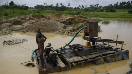 Men takes a break at an illegal mining site in Osogbo, Nigeria, on Tuesday , May 31, 2022. The Chief Priest of Osun Sacred rivers, Osunyemi Ifarinu, said due to illegal mining the Sacred water has been polluted and does not advise worshipers to drink it (AP Photo/Sunday Alamba)