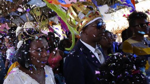 Adonildes da Cunha, right, Emperor, and Nilda dos Santos, left, Queen, arrive for a celebration after a Mass in the chapel of the Kalunga quilombo, during the culmination of the week-long pilgrimage and celebration for the patron saint 