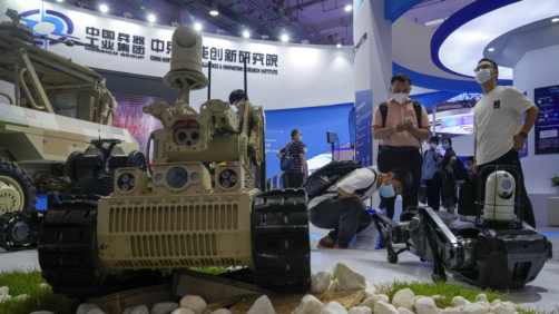 Visitors look at a Chinese-made robotic vehicles during the World Robot Conference at the Yichuang International Conference and Exhibition Centre in Beijing, Thursday, Aug. 18, 2022. (AP Photo/Andy Wong)