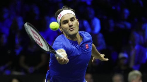 Team Europe's Roger Federer returns the ball as he and Rafael Nadal play in a Laver Cup doubles match against Team World's Jack Sock and Frances Tiafoe at the O2 arena in London, Friday, Sept. 23, 2022. (AP Photo/Kin Cheung)