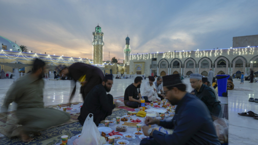 Muslims gather for a free public Iftar meal during the first day of Ramadan at sheikh Abdul qader Gilani mosque in Baghdad, Iraq, Thursday, March 23, 2023. Muslims throughout the world are marking the Ramadan -- a month of fasting during which observants abstain from food, drink and other pleasures from sunrise to sunset. (AP Photo/Hadi Mizban)