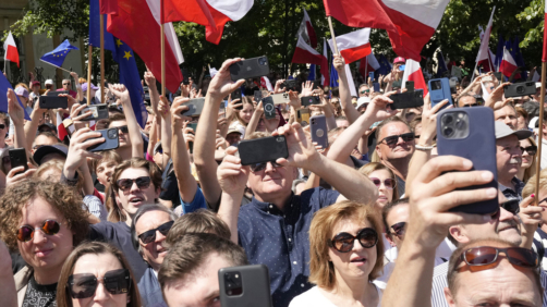 Participants join an anti-government march led by the centrist opposition party leader Donald Tusk, who along with other critics accuses the government of eroding democracy, in Warsaw, Poland, on June 4, 2023. The march is being held on the 34th anniversary of the first democratic elections in 1989 after Poland emerged from decades of communist rule. (AP Photo/Czarek Sokolowski)