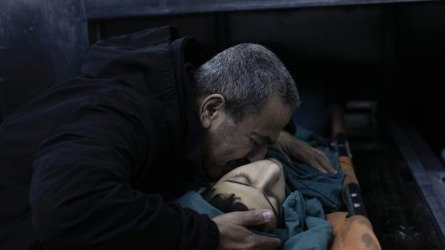 A relative mourns 15-year-old Basil Abu Al-Wafa, who was killed during an Israeli military raid on Jenin refugee camp in the West Bank on Wednesday, Nov. 29, 2023. (AP Photo/Majdi Mohammed)