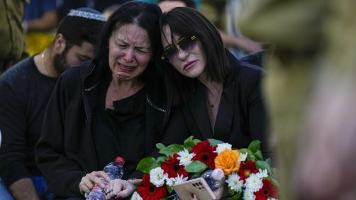 Helena Brodski cries during a memorial service for her son, Sgt. Kiril Brodski, at the Kiryat Shaul military cemetery in Tel Aviv, Wednesday, Nov. 29, 2023. Brodski and two other soldiers, believed to have been among those killed in the initial Oct. 7 Hamas attack, were declared dead by the military Tuesday, with their remains still in Gaza. (AP Photo/Ariel Schalit)