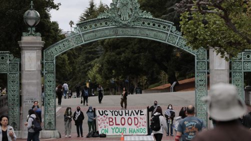epa11296678 Students stand under Sather Gate at the University of California Berkeley (UC Berkeley) campus to protest UC Berkeleys investment ties to Israel in Berkeley, California, USA, 23 April 2024. More than 34,000 Palestinians and over 1,450 Israelis have been killed, according to the Palestinian Health Ministry and the Israel Defense Forces (IDF), since Hamas militants launched an attack against Israel from the Gaza Strip on 07 October 2023, and the Israeli operations in Gaza and the West Bank which followed it.  EPA/JOHN G. MABANGLO
