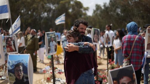 epa11336567 Two persons hug each other as they visit the memorial site for the victims of the Nova music festival killed in the 07 October Hamas attacks, on the occasion of Israel's Memorial Day, in Re'im, near the border with the Gaza Strip, southern Israel, 13 May 2024. More than 350 people were killed and several others taken hostage when militants from the Palestinian Islamist group Hamas attacked the music festival on 07 October 2023, according to the Israel Defence Forces (IDF). Israel marks Memorial Day (Yom HaZikaron) in remembrance of its fallen soldiers and victims of terrorism. According to the Israeli Ministry of Defense, 1,533 people, 711 security personnel and 822 civilians, have been killed since the 07 October Hamas attacks.  EPA/ATEF SAFADI